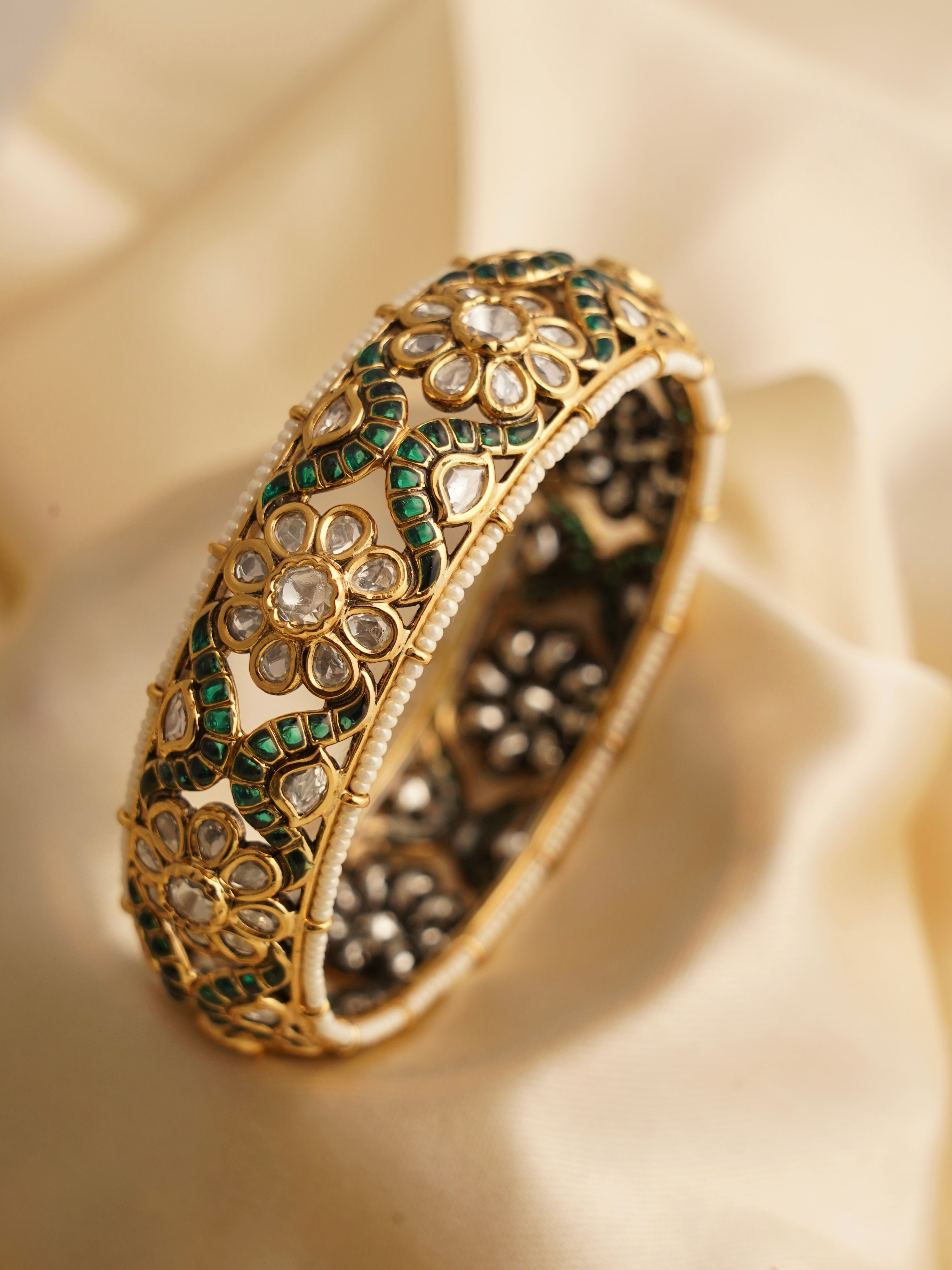 Close-up of polki kada featuring moissanite sparkle and intricate gold detailing